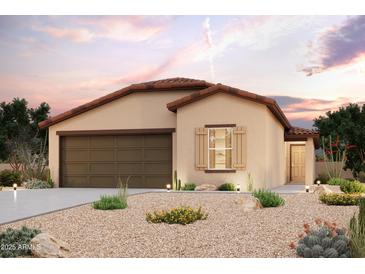 Charming single-story home featuring a tile roof, desert landscaping, and a two-car garage at 1381 W Hopi Dr, Coolidge, AZ 85128