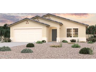 Charming single-story home featuring a two-car garage and low-maintenance desert landscaping at 1611 W Posada St, Coolidge, AZ 85128