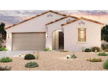 Charming single-story home with a two-car garage, a neutral color palette, and a well-manicured desert landscape at 1902 S 246Th Ln, Buckeye, AZ 85326