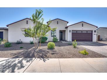 Charming single-story home featuring a well-maintained yard, desert landscaping, and a spacious two-car garage at 8009 W Northview Ave, Glendale, AZ 85303