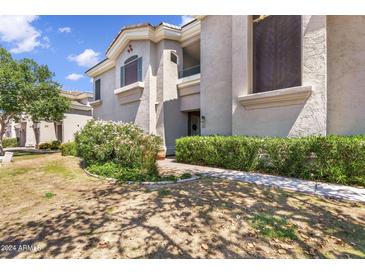 Charming home with well-maintained landscaping and a welcoming entrance at 8180 E Shea Blvd # 1038, Scottsdale, AZ 85260