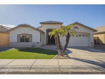 Charming single-Gathering home with a well-manicured lawn and a two-car garage at 12901 W Wilshire Dr, Avondale, AZ 85392
