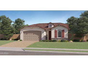 Charming single-story home featuring a 2-car garage, neutral stucco, and a brick-paved driveway leading to a lush green lawn at 1482 W Ridge Rd, Apache Junction, AZ 85120
