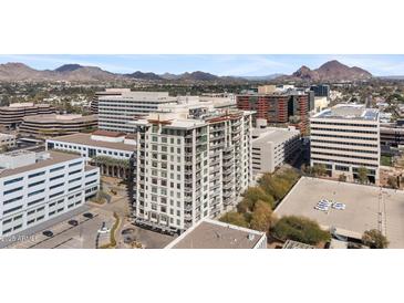 Modern high-rise condo with mountain views, offering luxurious urban living in a vibrant downtown setting at 2211 E Camelback Rd # 601, Phoenix, AZ 85016