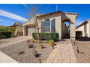 Charming single-story home with desert landscaping, a paved walkway, and a neutral-toned stucco exterior at 5844 S Tobin --, Mesa, AZ 85212