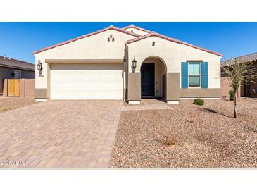 Charming single-story home with a two-car garage, neutral stucco exterior, and a well-maintained desert landscape at 11620 W Marguerite Ave, Avondale, AZ 85323