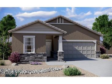 Charming one-story home featuring stone accents, neutral paint, and a two-car garage at 15665 W Deanne Dr, Waddell, AZ 85355