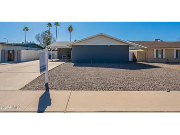 Charming single-story home featuring a well-kept gravel front yard and a clear blue sky at 1715 E El Parque Dr, Tempe, AZ 85282