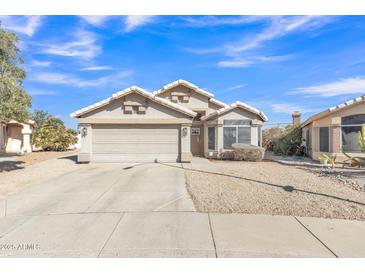 Charming single-story home featuring a well-maintained yard and attached two-car garage at 20837 N 23Rd Pl, Phoenix, AZ 85024