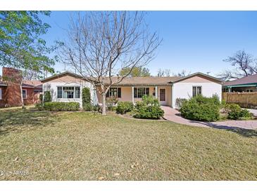 Charming single-story home with manicured lawn and mature landscaping in a peaceful residential neighborhood at 32 E 14Th St, Tempe, AZ 85281