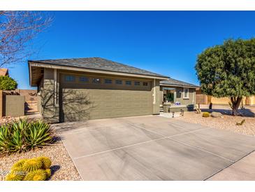 Beautiful single-story home featuring a spacious driveway and desert landscaping at 11026 E Nopal Ave, Mesa, AZ 85209