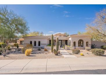 Elegant single-story home featuring desert landscaping and a barrel tile roof at 22970 N 79Th Pl, Scottsdale, AZ 85255