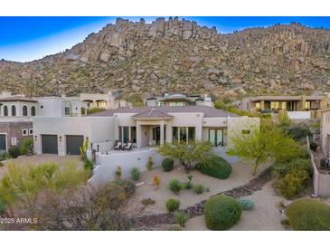 Expansive modern home with desert landscaping and a mountain backdrop at 25436 N 114Th St, Scottsdale, AZ 85255