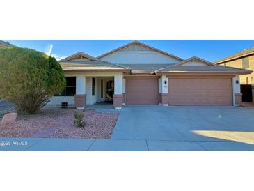 Charming single-story home features a well-manicured yard and a two-car garage at 3129 W Walter Way, Phoenix, AZ 85027