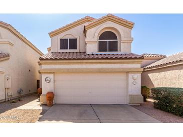 Inviting two-story home with a well-maintained front yard and neutral exterior paint at 3435 E Renee Dr, Phoenix, AZ 85050