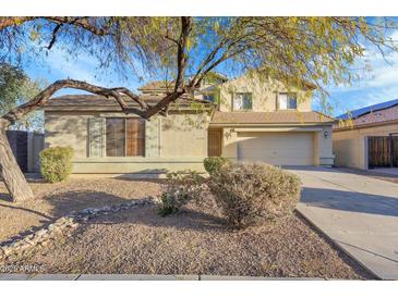 Charming two-story home featuring a two car garage and desert landscaping at 3524 W Alyssa Ln, Phoenix, AZ 85083