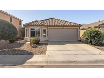 Charming single-story home with a tile roof, desert landscaping, and a two-car garage at 3967 E Hematite Ln, San Tan Valley, AZ 85143