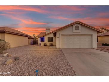 Charming single-story home with a two-car garage and desert landscaping at 4165 W Park Ave, Chandler, AZ 85226