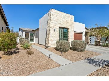 Stunning single story home showcasing a stone facade with low maintenance desert landscaping at 942 E Paseo Way, Phoenix, AZ 85042