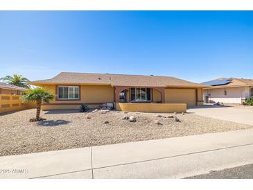 Charming single-story home with desert landscaping and a well-maintained exterior at 9513 W Cottonwood Dr, Sun City, AZ 85373