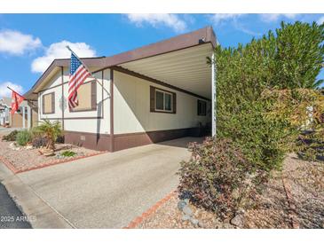 Charming home with a convenient carport and beautifully landscaped yard at 11596 W Sierra Dawn Blvd # 278, Surprise, AZ 85378