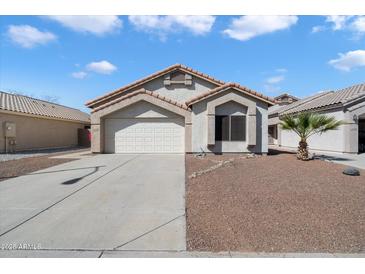 Charming single story home with well maintained desert landscaping, paver accents and tile roof at 14610 N 87Th Ave, Peoria, AZ 85381