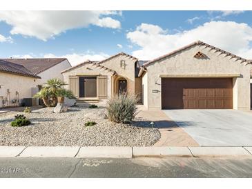 Charming single-story home with a stucco exterior, tile roof, and desert landscaping at 16372 W Mulberry Dr, Goodyear, AZ 85395