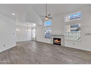 Bright, open living room with fireplace and ample natural light from the many windows at 1822 S 39Th St # 17, Mesa, AZ 85206