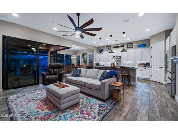 Spacious living room with an open floor plan features stylish furnishings and seamless indoor/outdoor living at 2034 N Dome Rock --, Mesa, AZ 85207