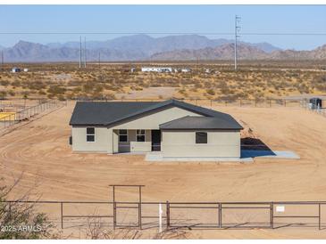 Charming single-story home with desert landscape and mountain views at 57856 W Fulcar Rd, Maricopa, AZ 85139