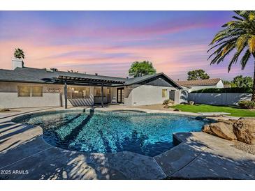 Beautiful backyard pool and patio area, perfect for relaxing or entertaining outdoors at 8237 E Lippizan Trl, Scottsdale, AZ 85258