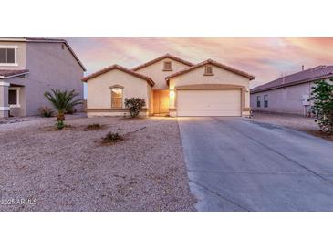 Charming single-story home with a two car garage and desert landscaping at 2225 E Andalusian Loop, San Tan Valley, AZ 85140