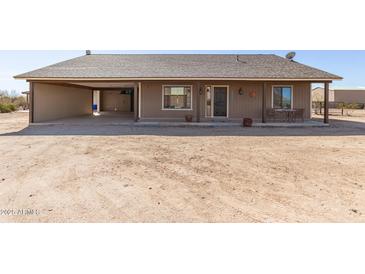 Charming single-story home with a covered porch and a convenient carport, perfect for desert living at 36249 N 7Th St, Phoenix, AZ 85086