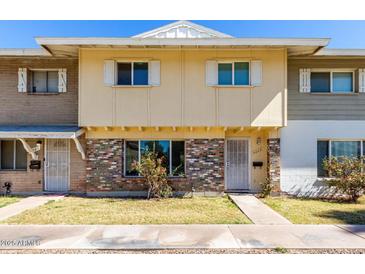 Charming townhome with brick accents, tidy lawn, and well-maintained facade at 4003 S Mill Ave, Tempe, AZ 85282