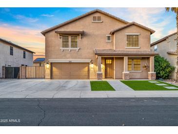 Charming two-story home with a well-maintained lawn, two car garage, and inviting front porch at 12118 W Villa Chula Ct, Sun City, AZ 85373