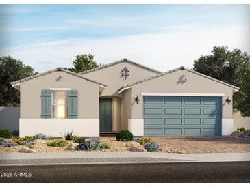 Charming single-story home with blue garage door and shutters and well manicured desert landscaping at 129 N 175Th Ave, Goodyear, AZ 85338