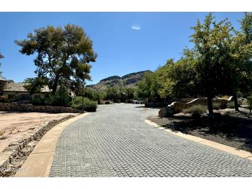 Cobblestone driveway leading to property with mountain views at 5701 E Mockingbird Ln, Paradise Valley, AZ 85253