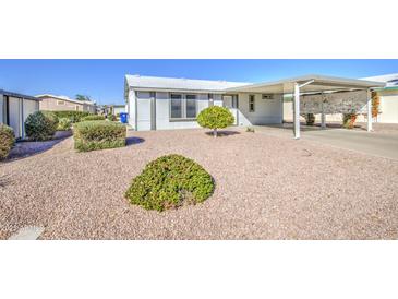 Charming single-story home with desert landscaping and a covered carport at 8500 E Southern Ave # 463, Mesa, AZ 85209