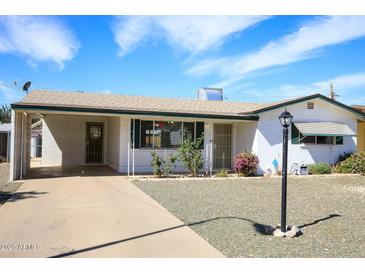 Charming single-story home featuring a well-maintained front yard and covered parking at 1510 S Lawther Dr, Apache Junction, AZ 85120