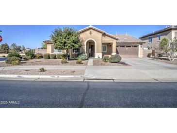 Charming single-story home with a well-manicured front yard and inviting entrance in a suburban neighborhood at 18618 E Mockingbird Dr, Queen Creek, AZ 85142