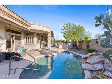 Beautiful backyard pool and patio area, perfect for outdoor entertaining and relaxation at 42047 N Moss Springs Rd, Anthem, AZ 85086