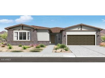 Charming single-story home with stone accents, a two car garage, and professionally landscaped yard at 14194 W Sand Hills Rd, Surprise, AZ 85387