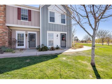 Charming townhouse featuring manicured lawn and sidewalk leading to the entrance at 1600 N Saba St # 177, Chandler, AZ 85225