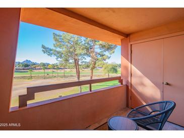 Balcony with seating, overlooking a golf course and distant mountains at 4303 E Cactus Rd # 326, Phoenix, AZ 85032