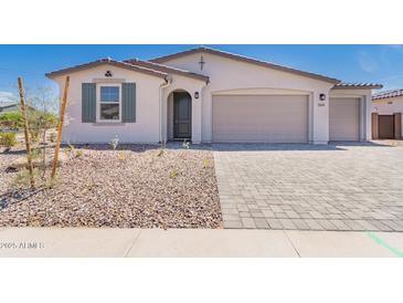 Charming single-story home featuring a two-car garage, neutral stucco, and low-maintenance landscaping at 12361 W Marguerite Ave, Avondale, AZ 85323