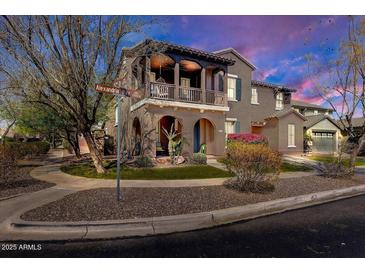 Charming two-story home featuring a covered balcony and inviting curb appeal at 15260 W Alexandria Way, Surprise, AZ 85379