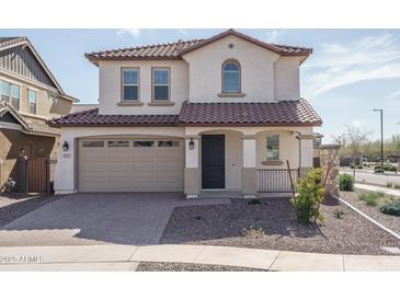 Charming two-story home with a tile roof, two-car garage, and a well-maintained front yard at 16277 W Mariposa Grande --, Surprise, AZ 85387