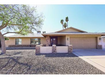 Charming single-story home featuring a well-maintained front yard and attached two-car garage at 2901 W Straford Dr, Chandler, AZ 85224