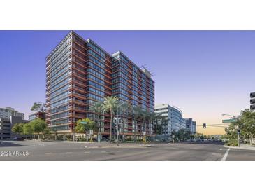 Modern high-rise building featuring extensive glass facade and street-level palm tree landscaping at 4808 N 24Th St # 1305, Phoenix, AZ 85016