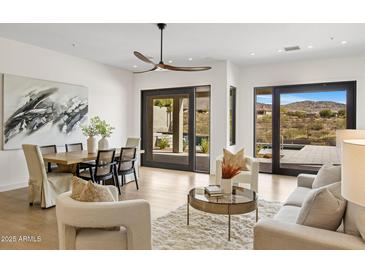 Bright and airy living room with modern furniture and sliding glass doors to the patio at 10819 E Butherus Drive --, Scottsdale, AZ 85255